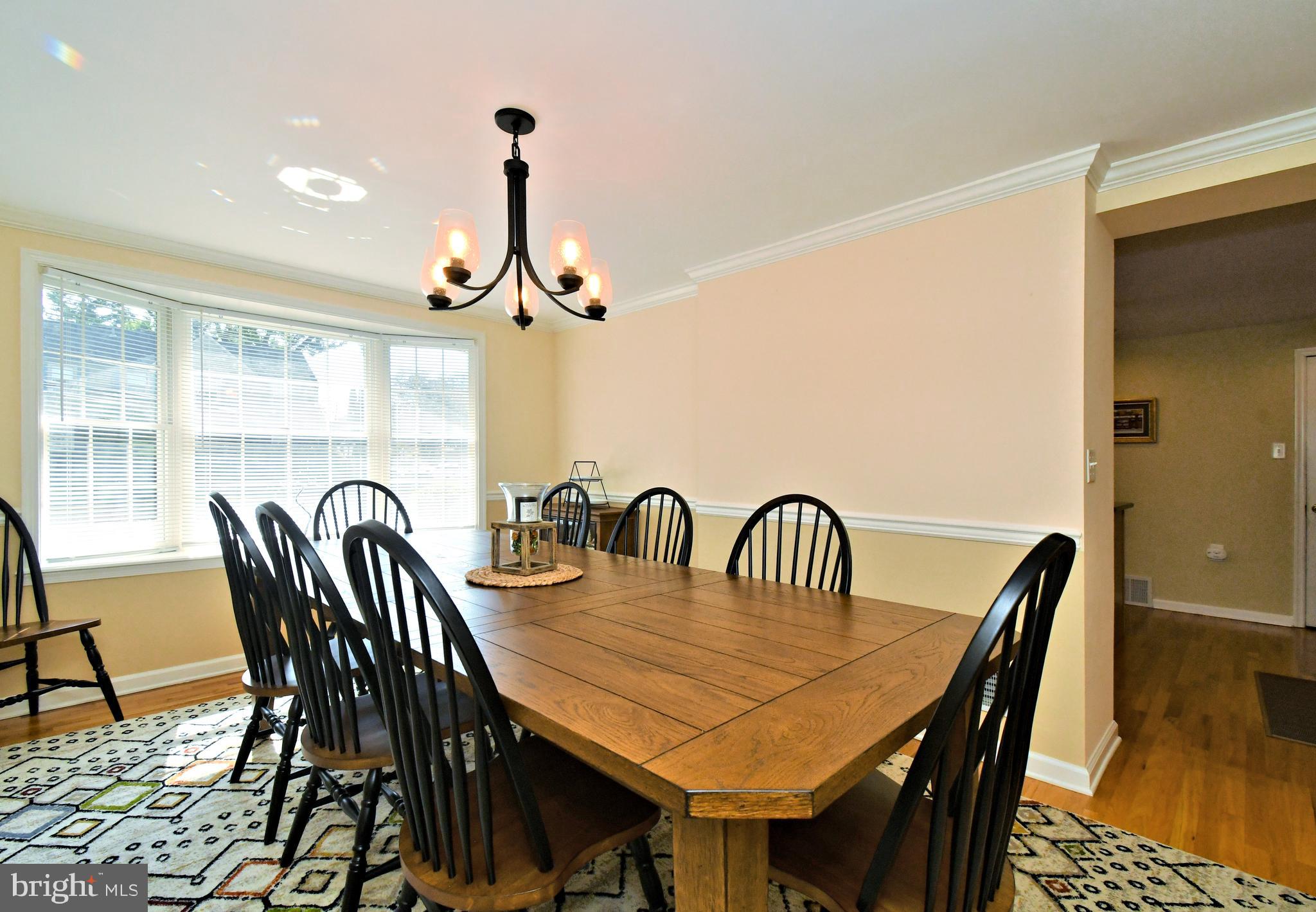 442 Oreland Mill Road Oreland, PA 19075 - Photo 17 of 68 a dining room with furniture a rug and a chandelier