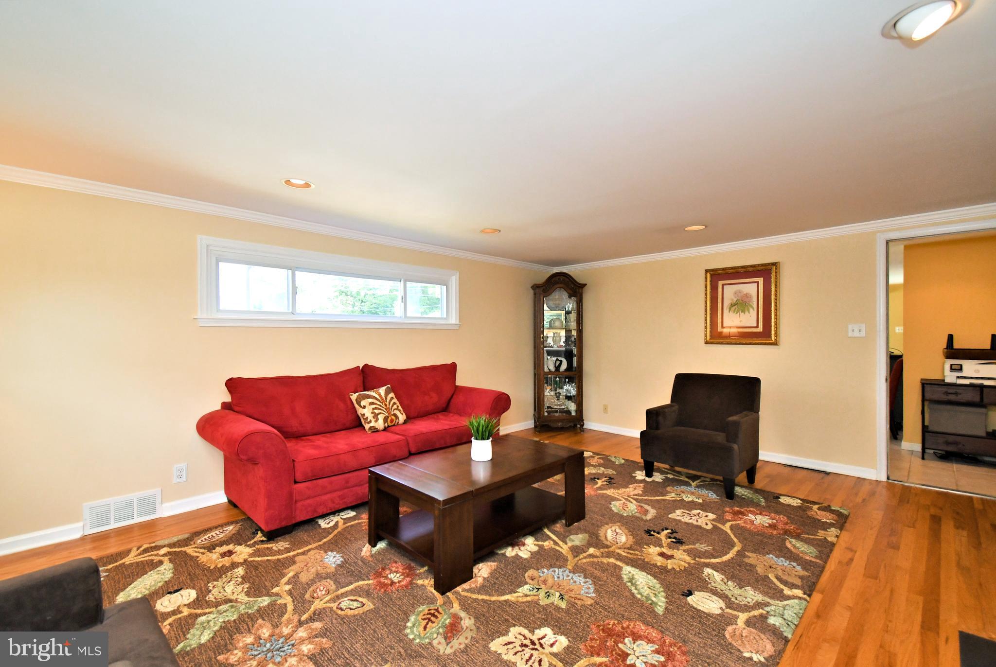 442 Oreland Mill Road Oreland, PA 19075 - Photo 19 of 68 a living room with furniture a rug and a wooden floor
