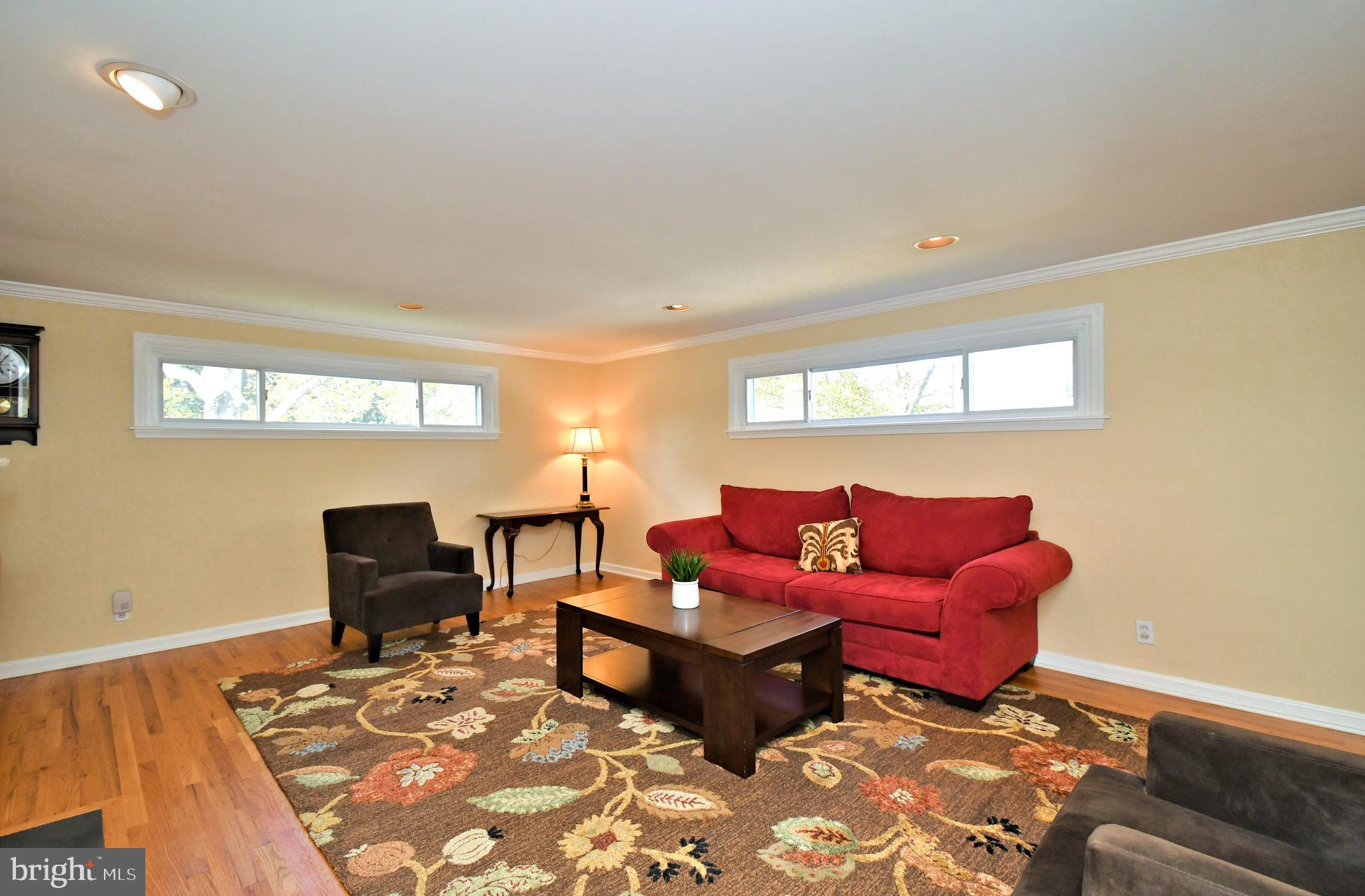 442 Oreland Mill Road Oreland, PA 19075 - Photo 22 of 68 a living room with furniture a rug and a window