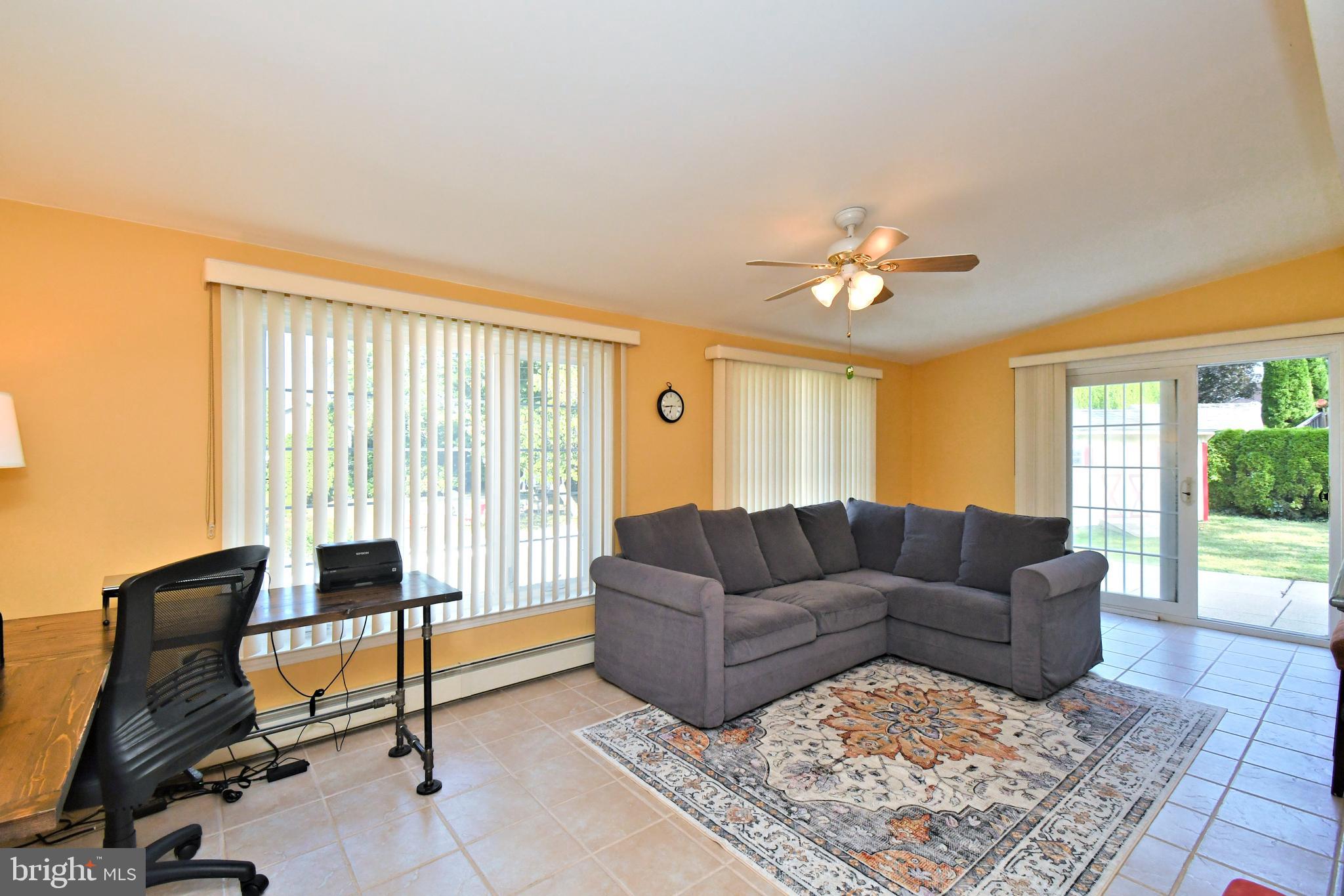 442 Oreland Mill Road Oreland, PA 19075 - Photo 23 of 68 a living room with furniture and a large window