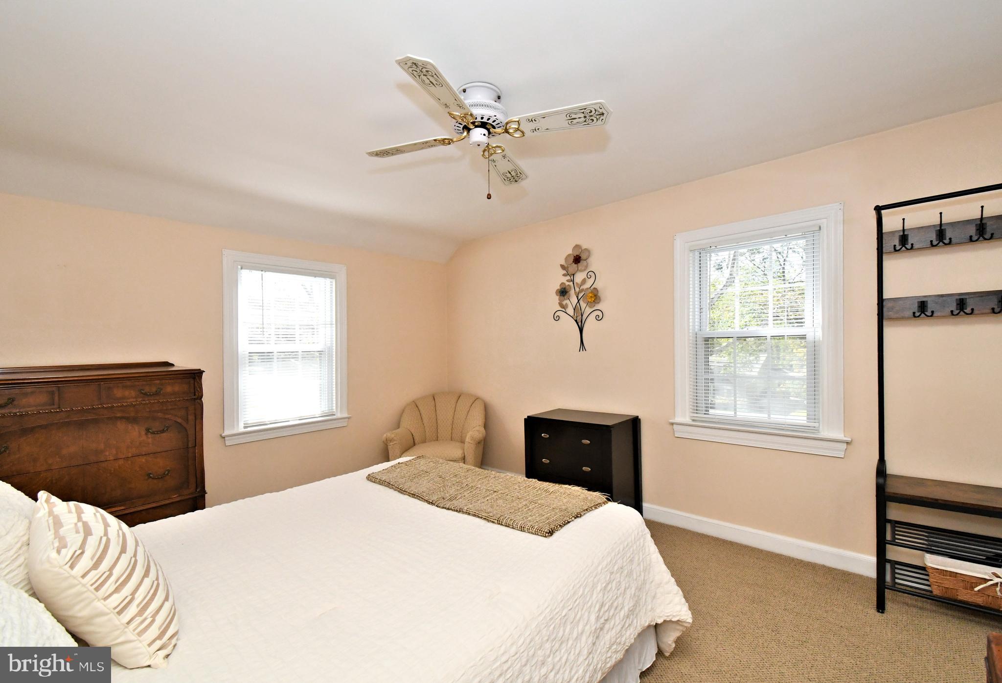 442 Oreland Mill Road Oreland, PA 19075 - Photo 30 of 68 a bedroom with a bed and wooden floor