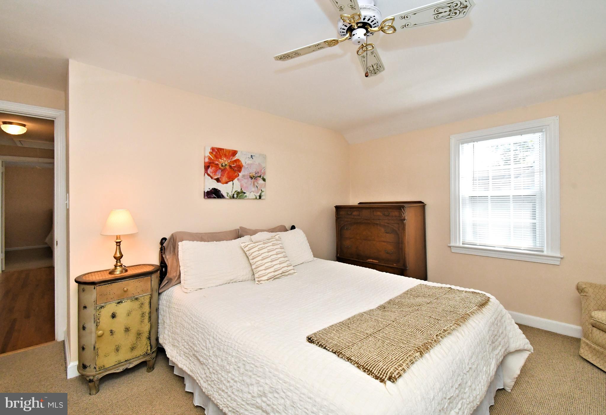 442 Oreland Mill Road Oreland, PA 19075 - Photo 31 of 68 a bedroom with a bed and a chandelier