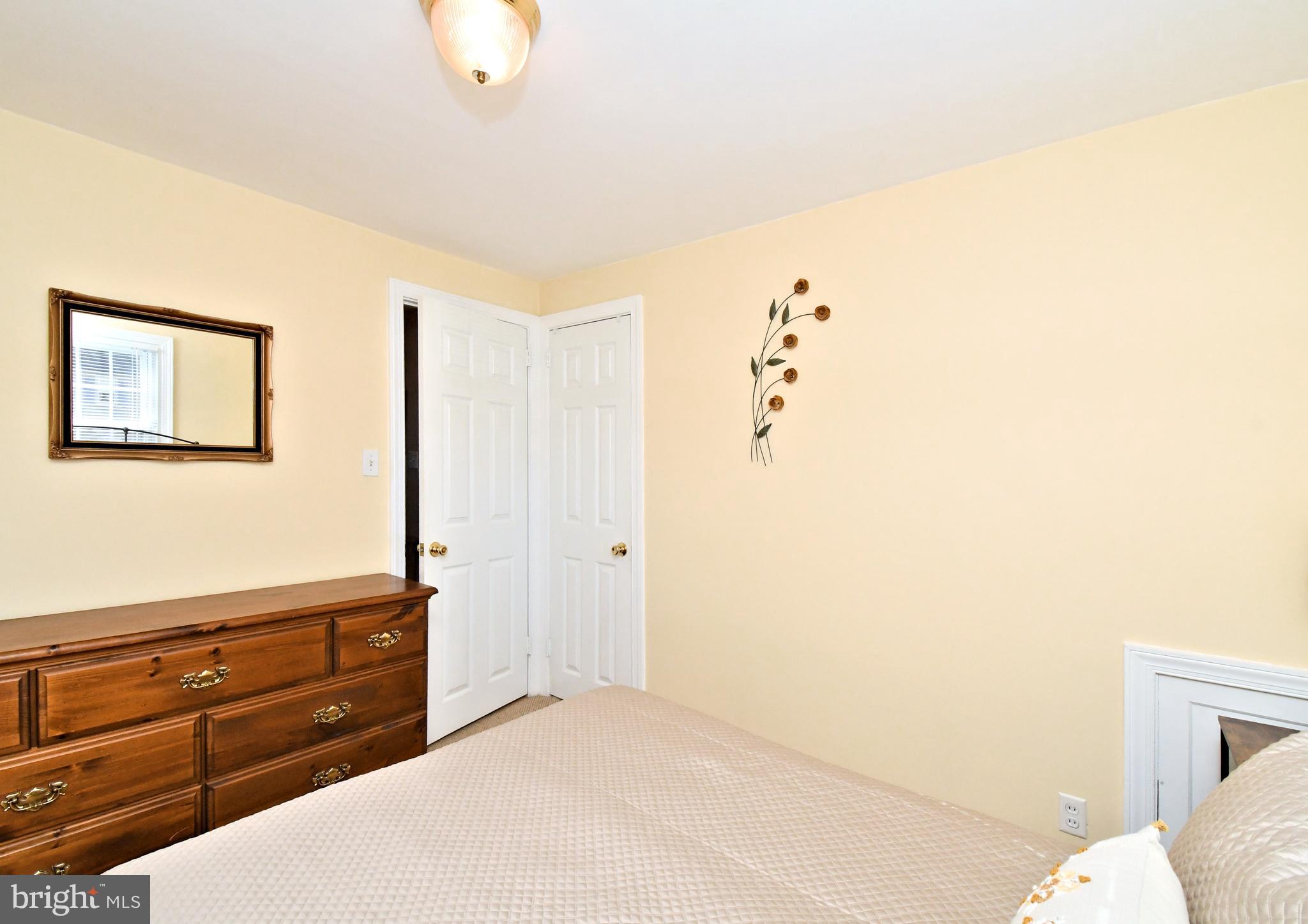 442 Oreland Mill Road Oreland, PA 19075 - Photo 35 of 68 a bedroom with a bed and a dresser in it