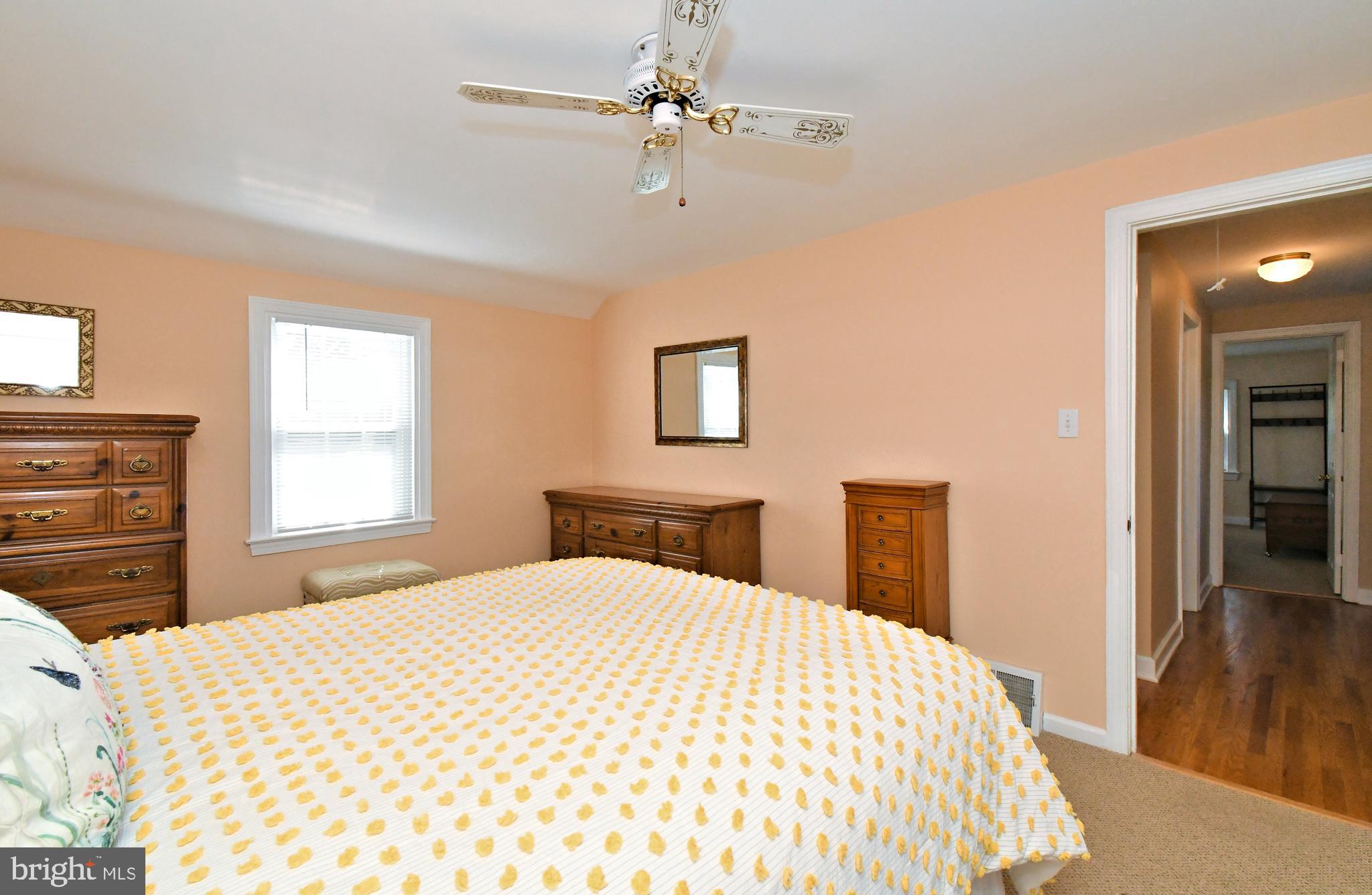 442 Oreland Mill Road Oreland, PA 19075 - Photo 37 of 68 a bedroom with a large bed and a chandelier