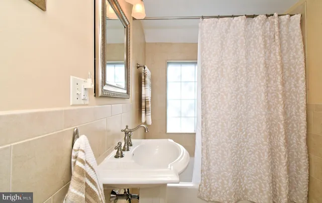 a living room with furniture a dining table and a stove top oven