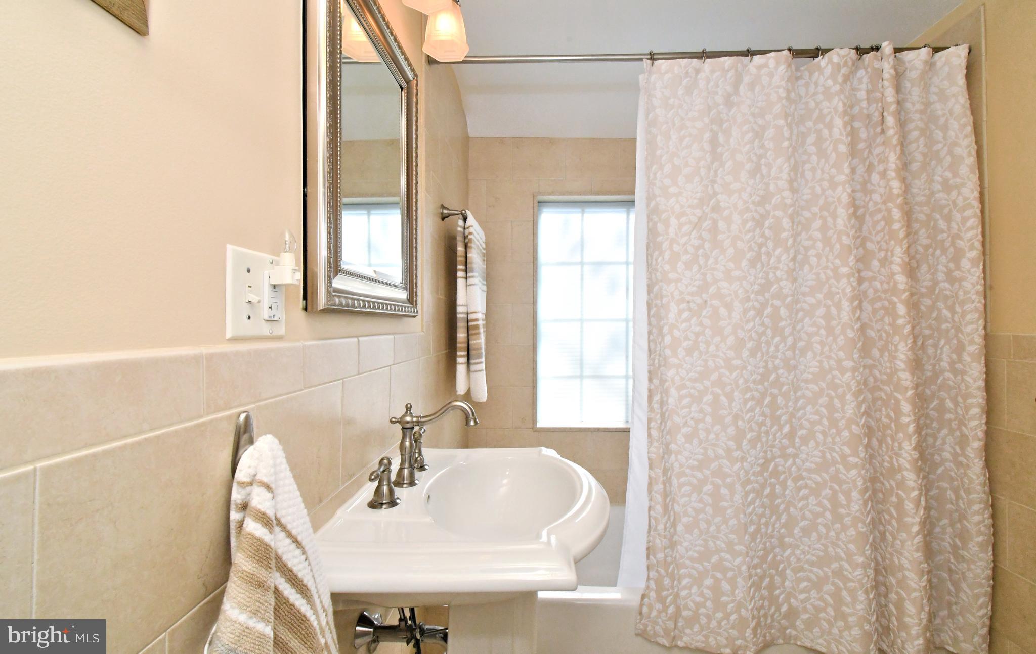 442 Oreland Mill Road Oreland, PA 19075 - Photo 39 of 68 a bathroom with a sink and a mirror