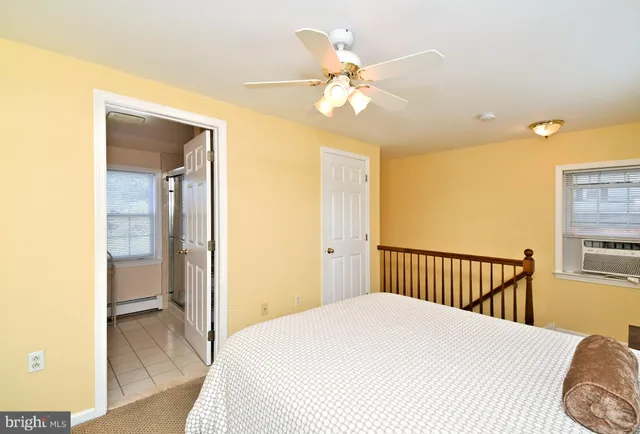 a picture of a bench in front of a window