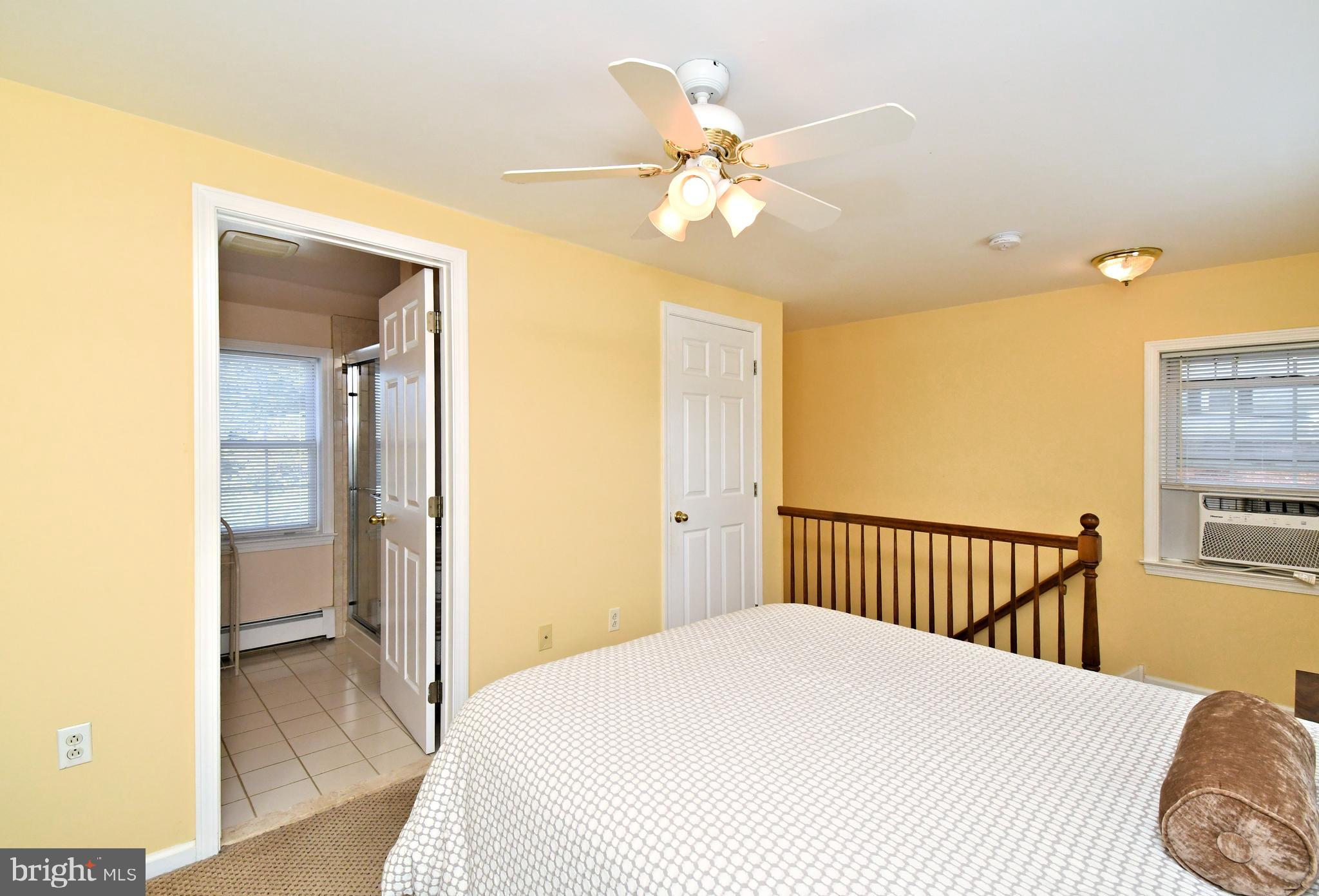 442 Oreland Mill Road Oreland, PA 19075 - Photo 50 of 68 a bedroom with a bed and wooden floor