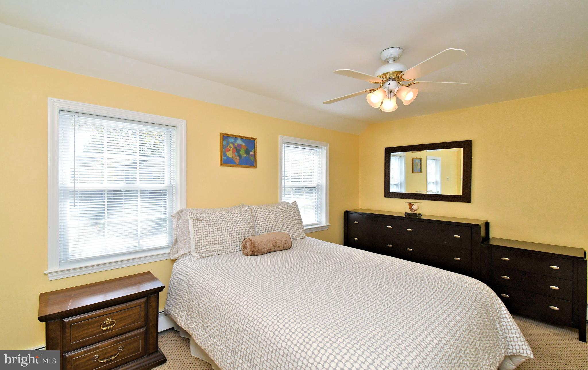 442 Oreland Mill Road Oreland, PA 19075 - Photo 52 of 68 a bedroom with a bed and a chandelier