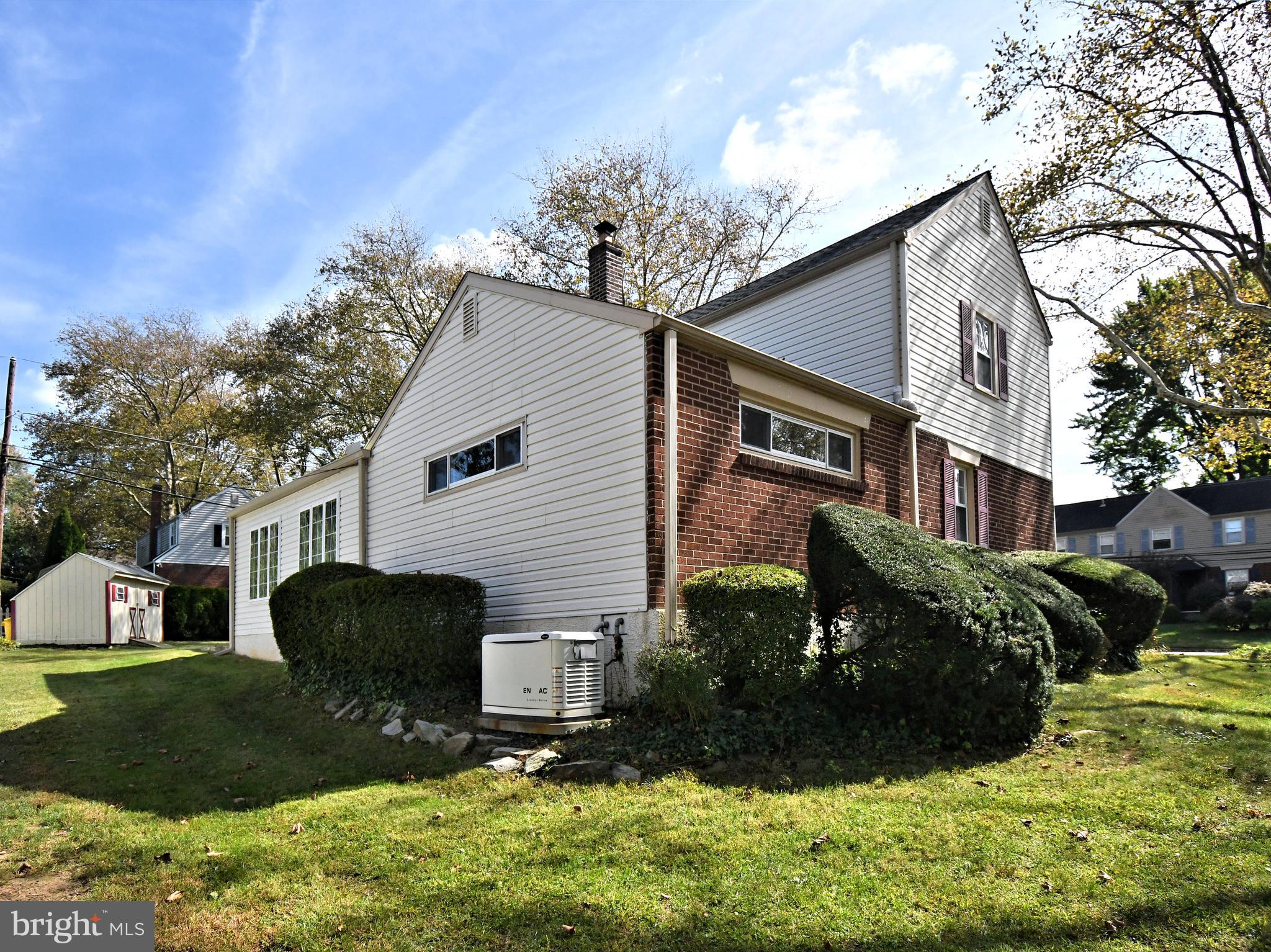 442 Oreland Mill Road Oreland, PA 19075 - Photo 60 of 68 a front view of a house with a yard and garage