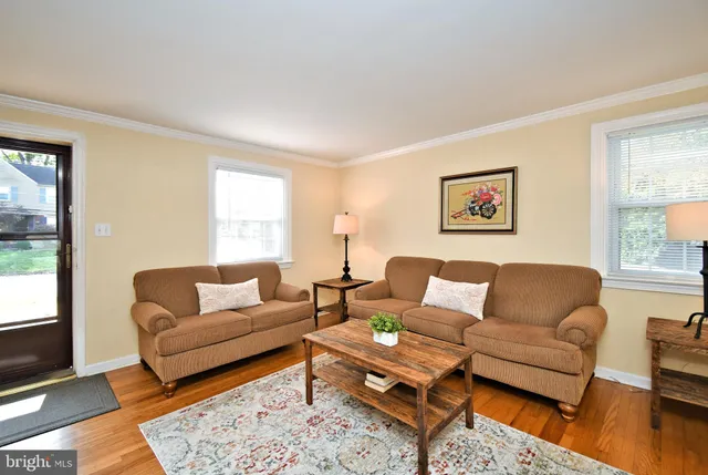 a living room with furniture fireplace and a flat screen tv