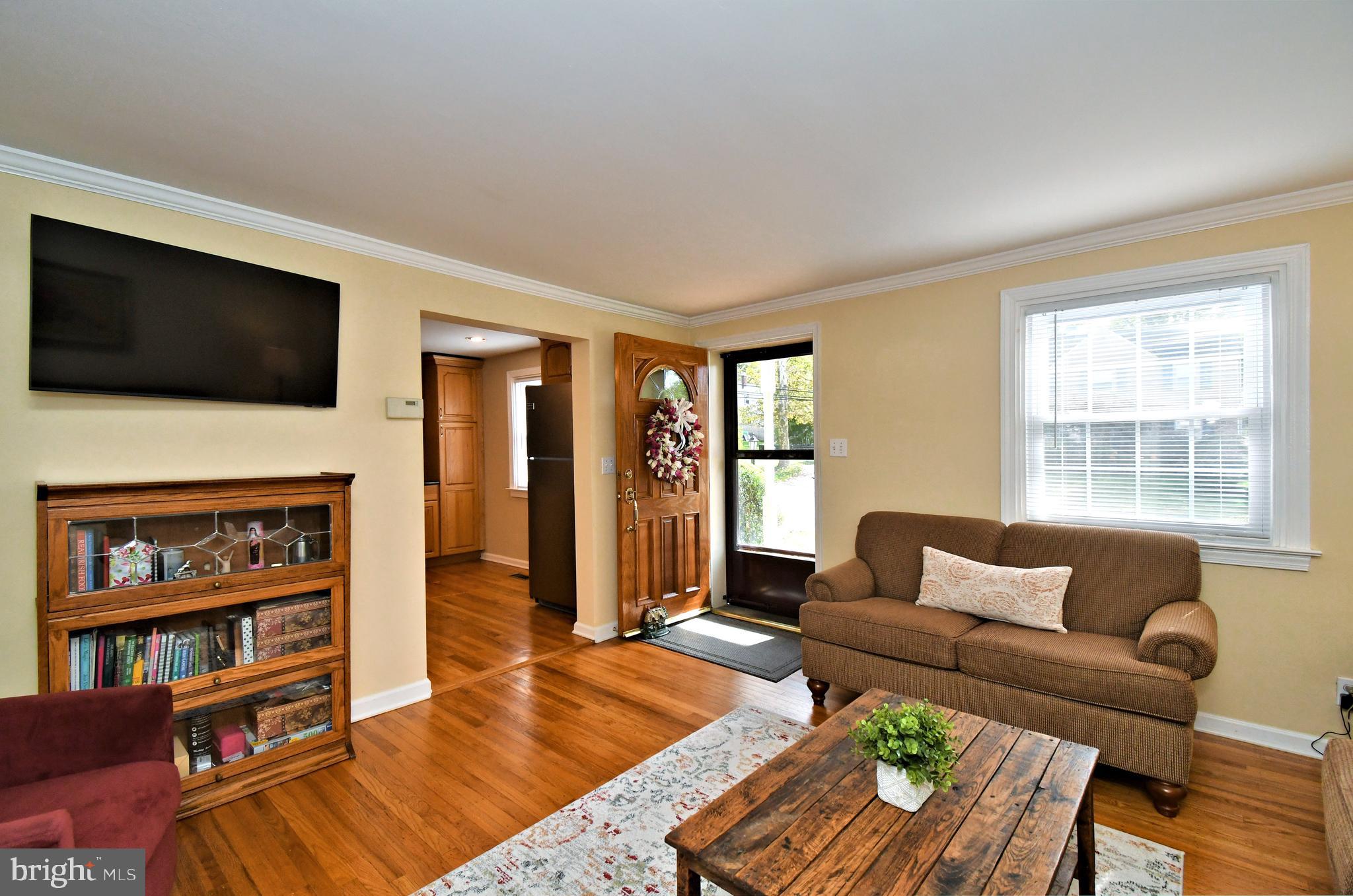 442 Oreland Mill Road Oreland, PA 19075 - Photo 8 of 68 a living room with furniture fireplace and a flat screen tv