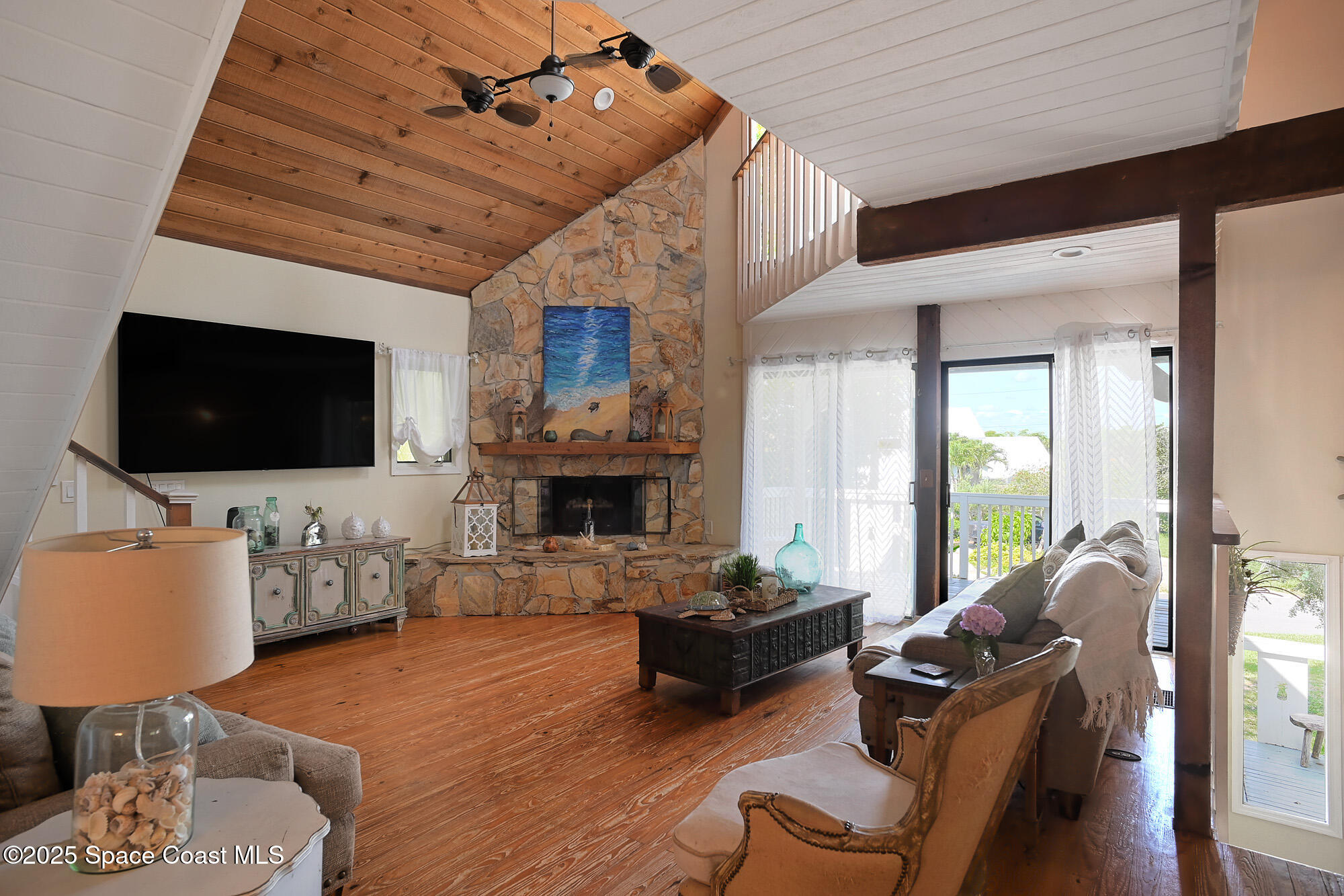 5875 Riverside Drive Melbourne Beach, FL 32951 - Photo 5 of 41 Living room with high vaulted ceiling