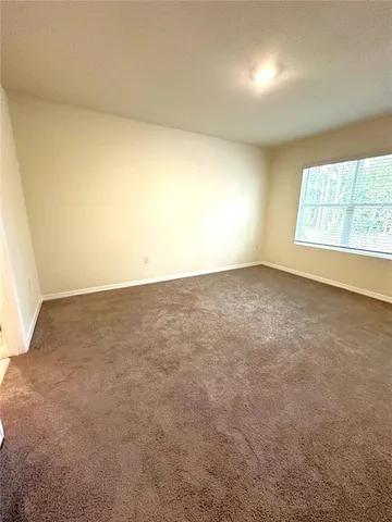 an empty room with a windows