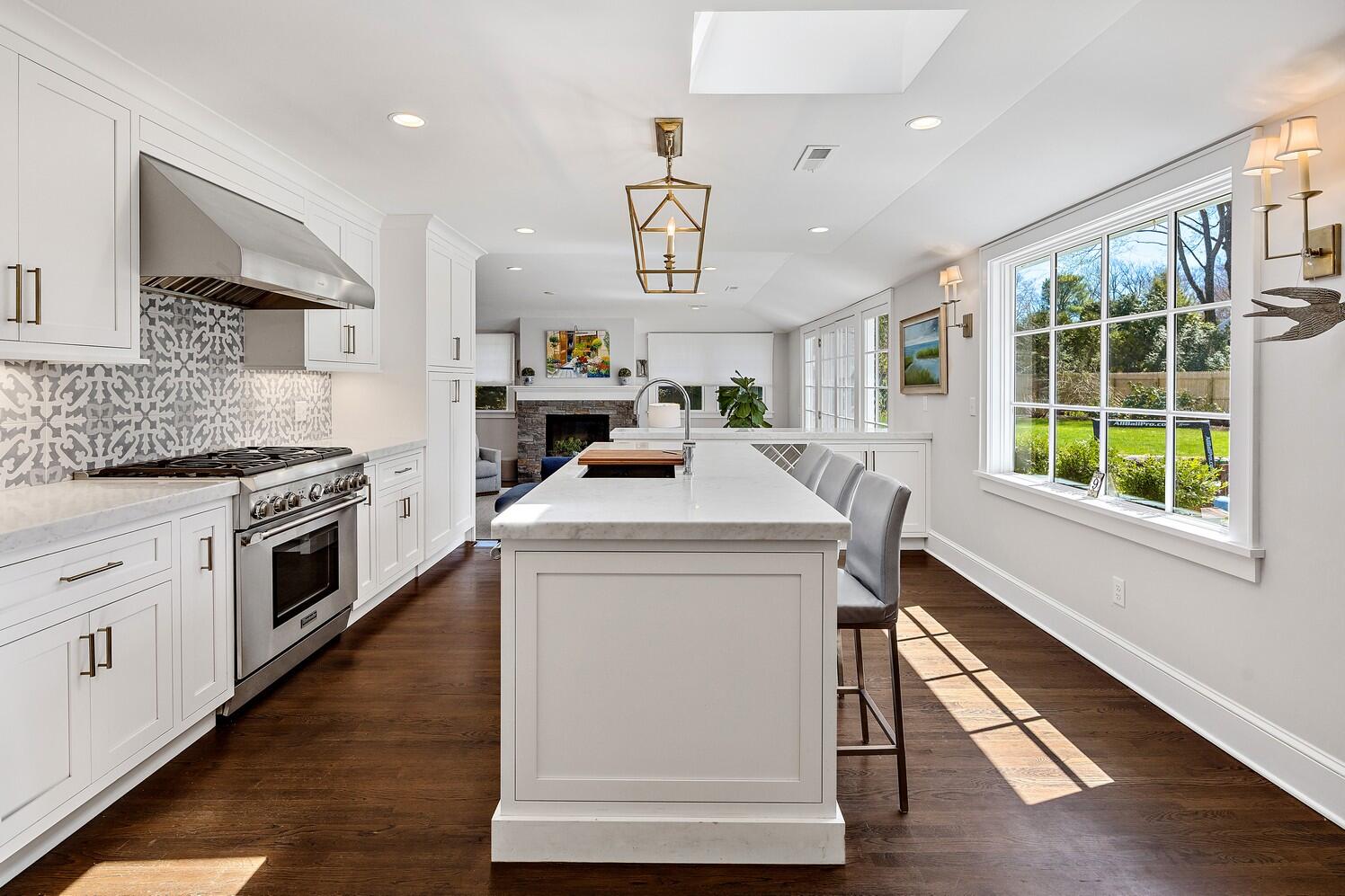 9 Beach Drive Darien, CT 06820 - Photo 16 of 39 a kitchen with a stove a sink and a window