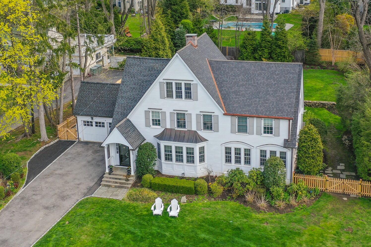 9 Beach Drive Darien, CT 06820 - Photo 3 of 39 front view of house with a yard