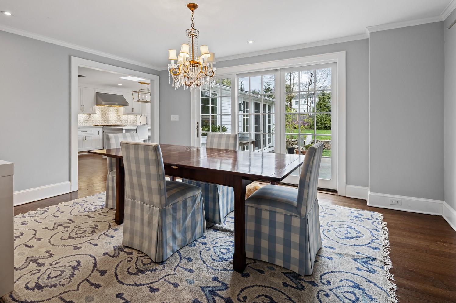 9 Beach Drive Darien, CT 06820 - Photo 22 of 39 a view of a dining room with furniture window and wooden floor