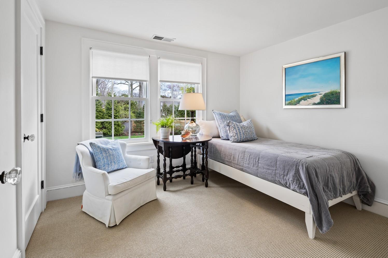 9 Beach Drive Darien, CT 06820 - Photo 33 of 39 a bedroom with a bed and a large window