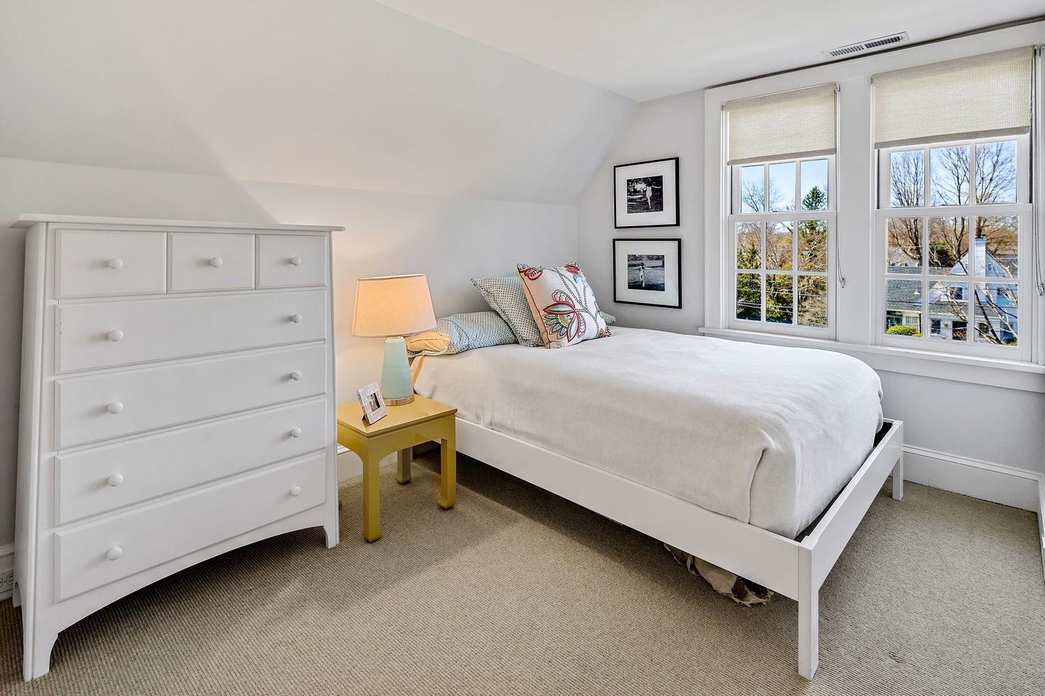 9 Beach Drive Darien, CT 06820 - Photo 37 of 39 a bedroom with a bed and a dresser