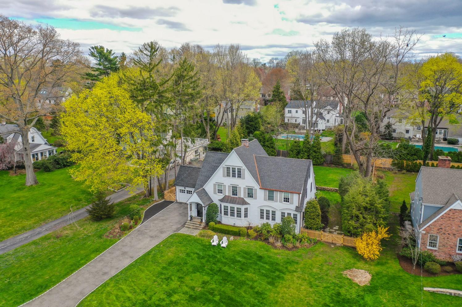 9 Beach Drive Darien, CT 06820 - Photo 39 of 39 a view of a house next to a big yard with large trees