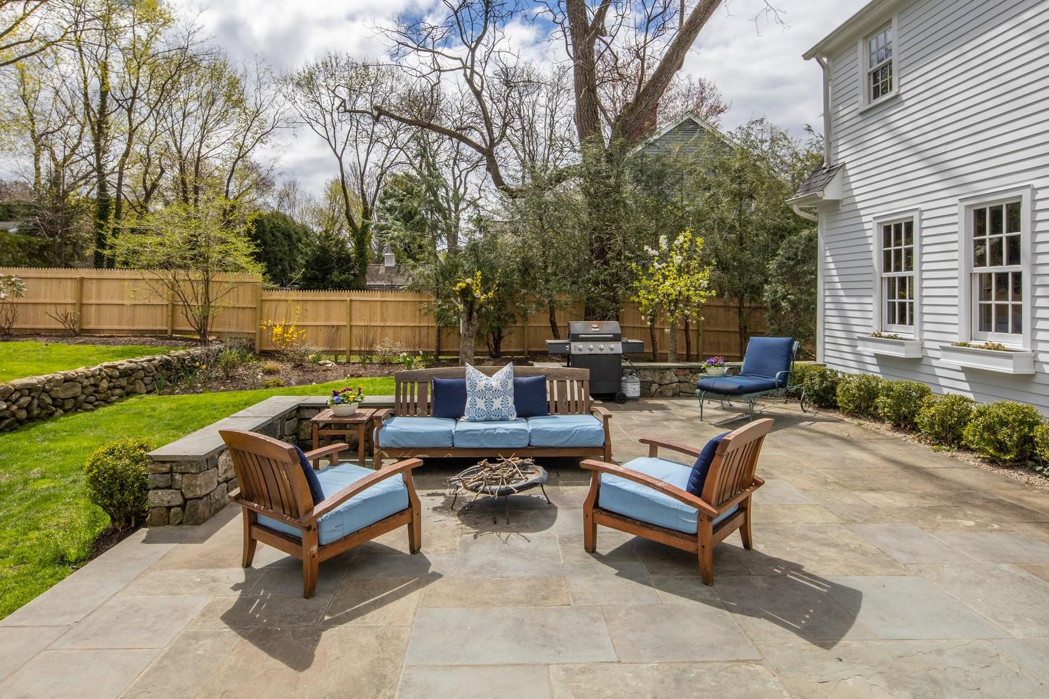 9 Beach Drive Darien, CT 06820 - Photo 9 of 39 a swimming pool with outdoor seating and a garden