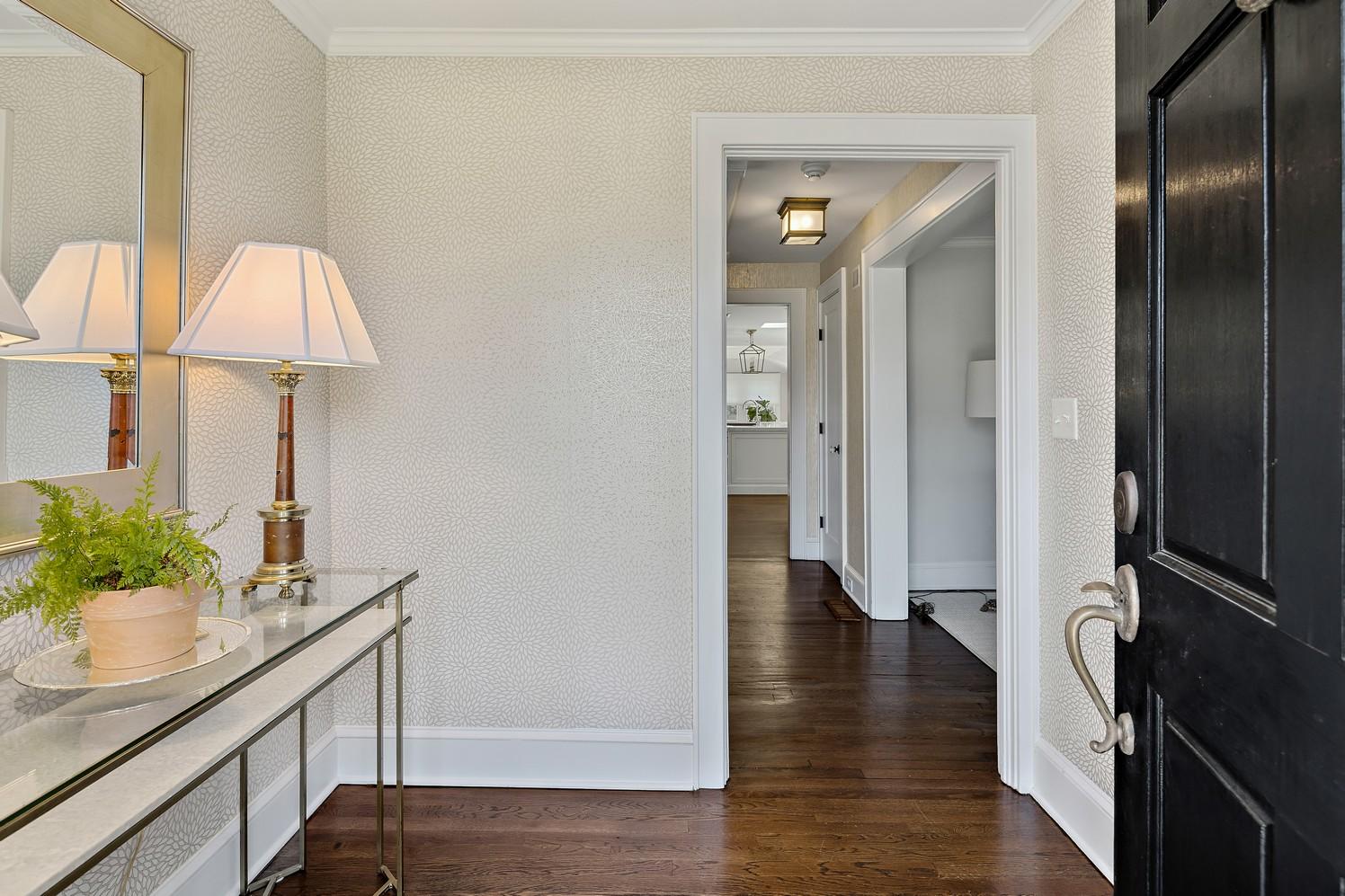 9 Beach Drive Darien, CT 06820 - Photo 10 of 39 a view of a hallway with wooden floor and cabinet