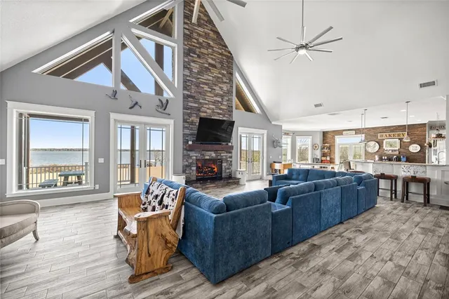 a view of a livingroom with wooden floor and window