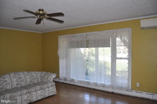 a living room with couch and a window