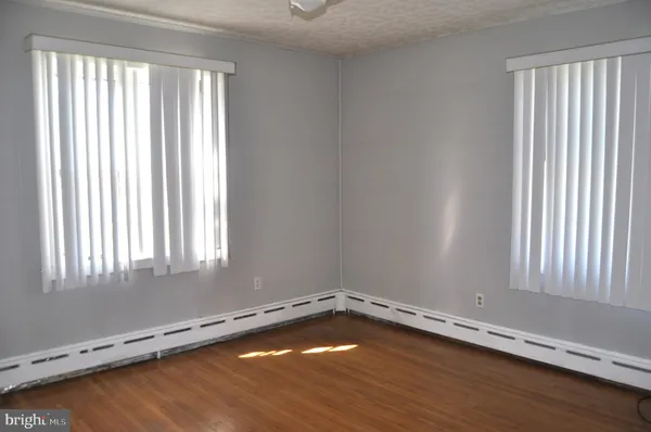 wooden floor and window in a room