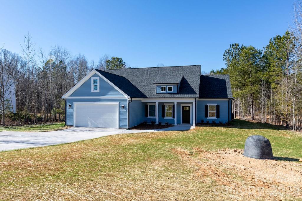 4018 Deerstone Lane, Unit 24 Clover, SC 29710 - Photo 3 of 48 a view of a house with a yard and large tree