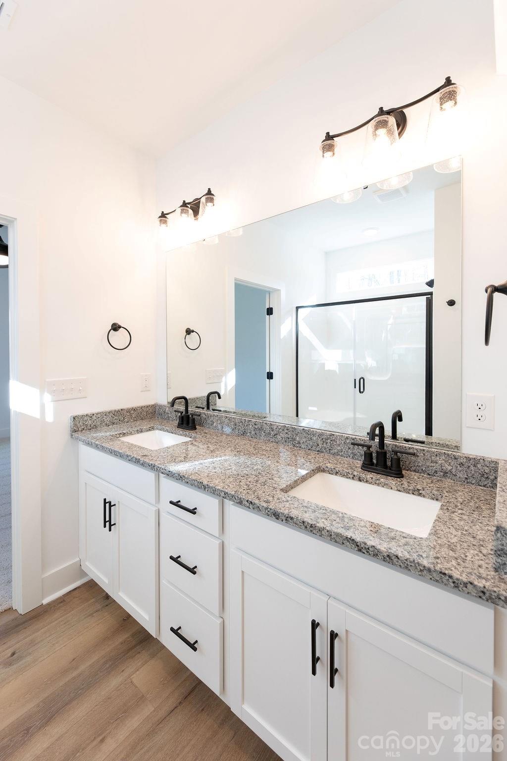 4018 Deerstone Lane, Unit 24 Clover, SC 29710 - Photo 35 of 48 a bathroom with a granite countertop sink and a mirror