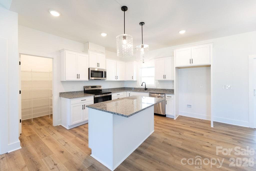 4018 Deerstone Lane, Unit 24 Clover, SC 29710 - Photo 44 of 48 a kitchen with a sink window and stainless steel appliances