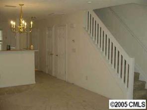 8312 Rudolph Road, Unit 8312 Charlotte, NC 28216 - Photo 3 of 8 a view of a hallway with chandelier