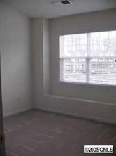 8312 Rudolph Road, Unit 8312 Charlotte, NC 28216 - Photo 4 of 8 a view of an empty room with a window
