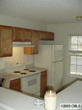 8312 Rudolph Road, Unit 8312 Charlotte, NC 28216 - Photo 8 of 8 a kitchen with a stove and a sink
