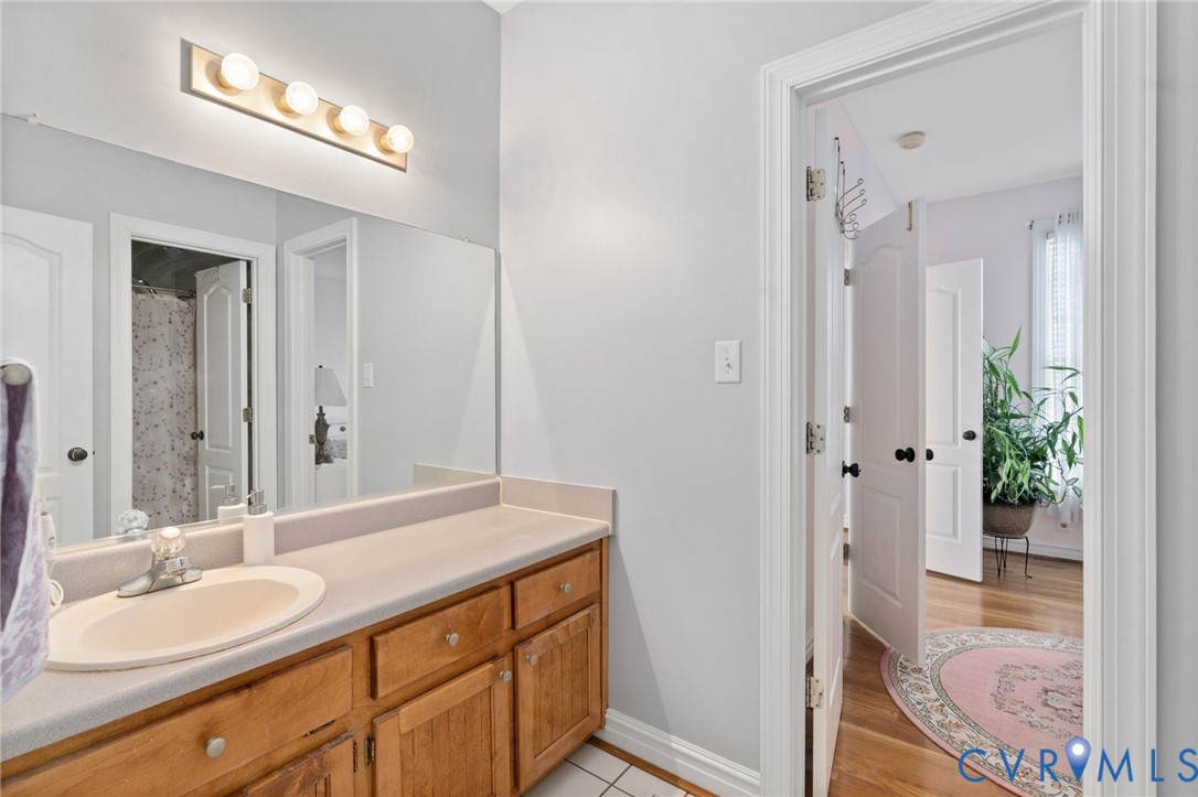 300 Lighthouse Pointe Hopewell, VA 23860 - Photo 13 of 19 a bathroom with a granite countertop sink a mirror and a shower