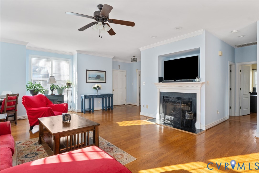 300 Lighthouse Pointe Hopewell, VA 23860 - Photo 7 of 19 a living room with furniture a flat screen tv and a fireplace