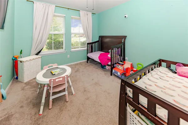 a bedroom with a bed and a table