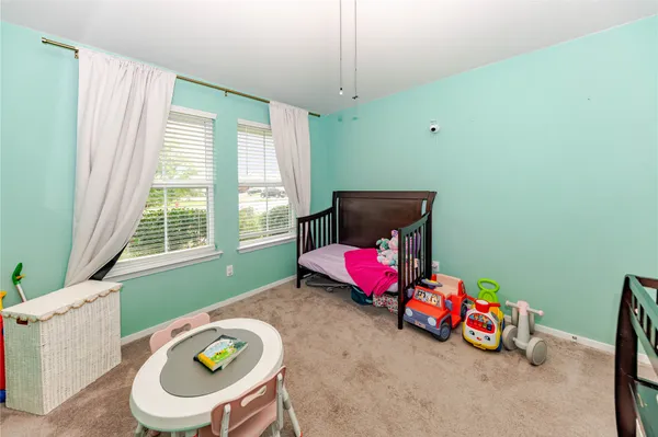 a kids room with toys and window