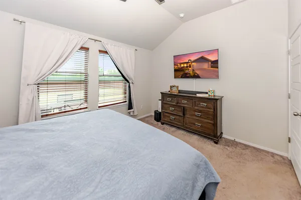 a view of walk in closet with clothes