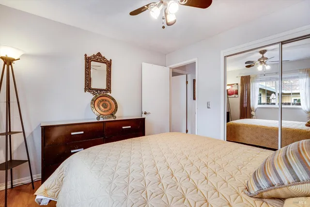 a bedroom with a bed and lamp