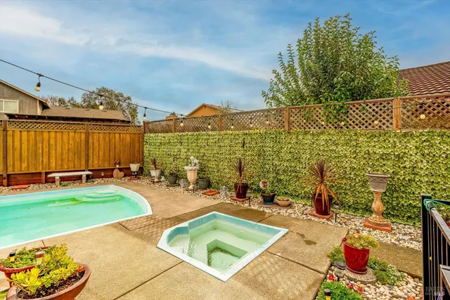 a view of a swimming pool with a lounge chairs