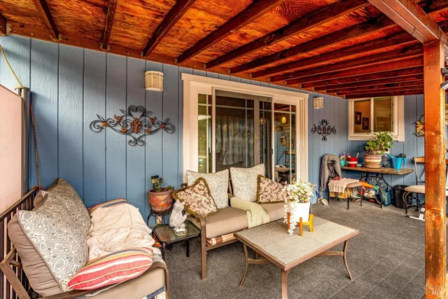 a outdoor living space with furniture and a potted plant