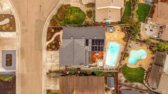 an aerial view of residential houses with outdoor space