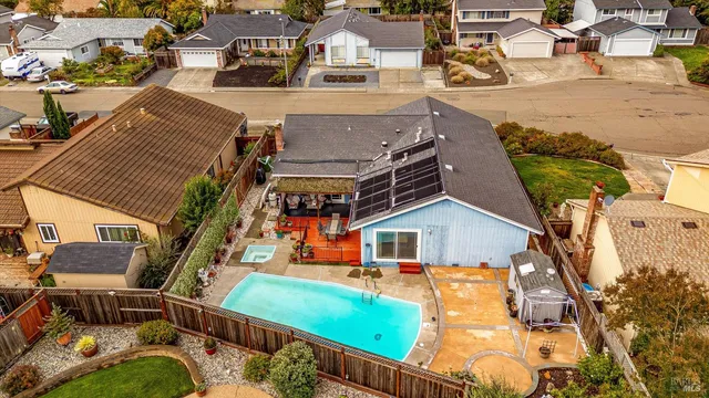 an aerial view of a house with outdoor space
