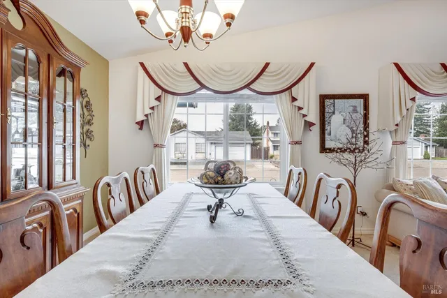 a view of a livingroom with furniture window and wooden floor