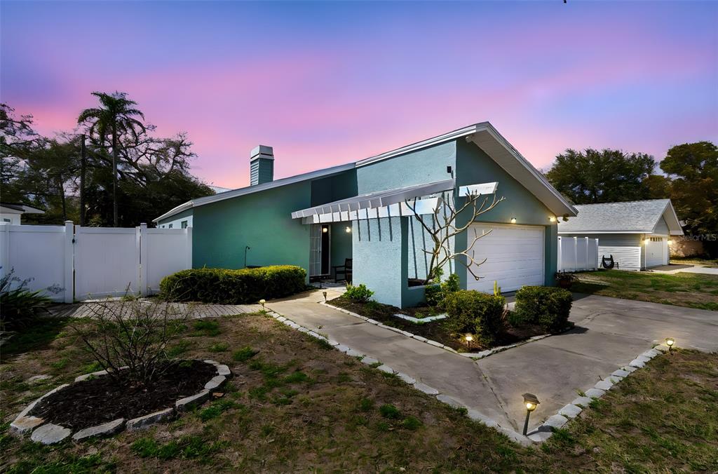 a front view of a house with garden
