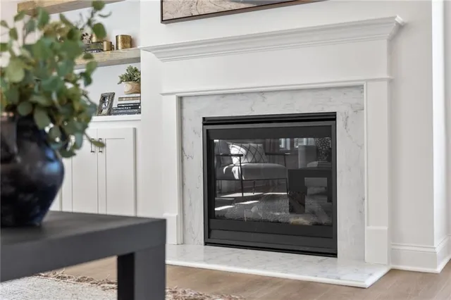 a view of a living room that has a fireplace