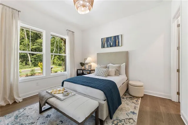 a view of a hallway with windows and entryway