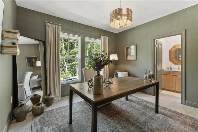 a bathroom with a sink and a white cabinets